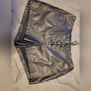 Faux leather shorts with lace up detail.